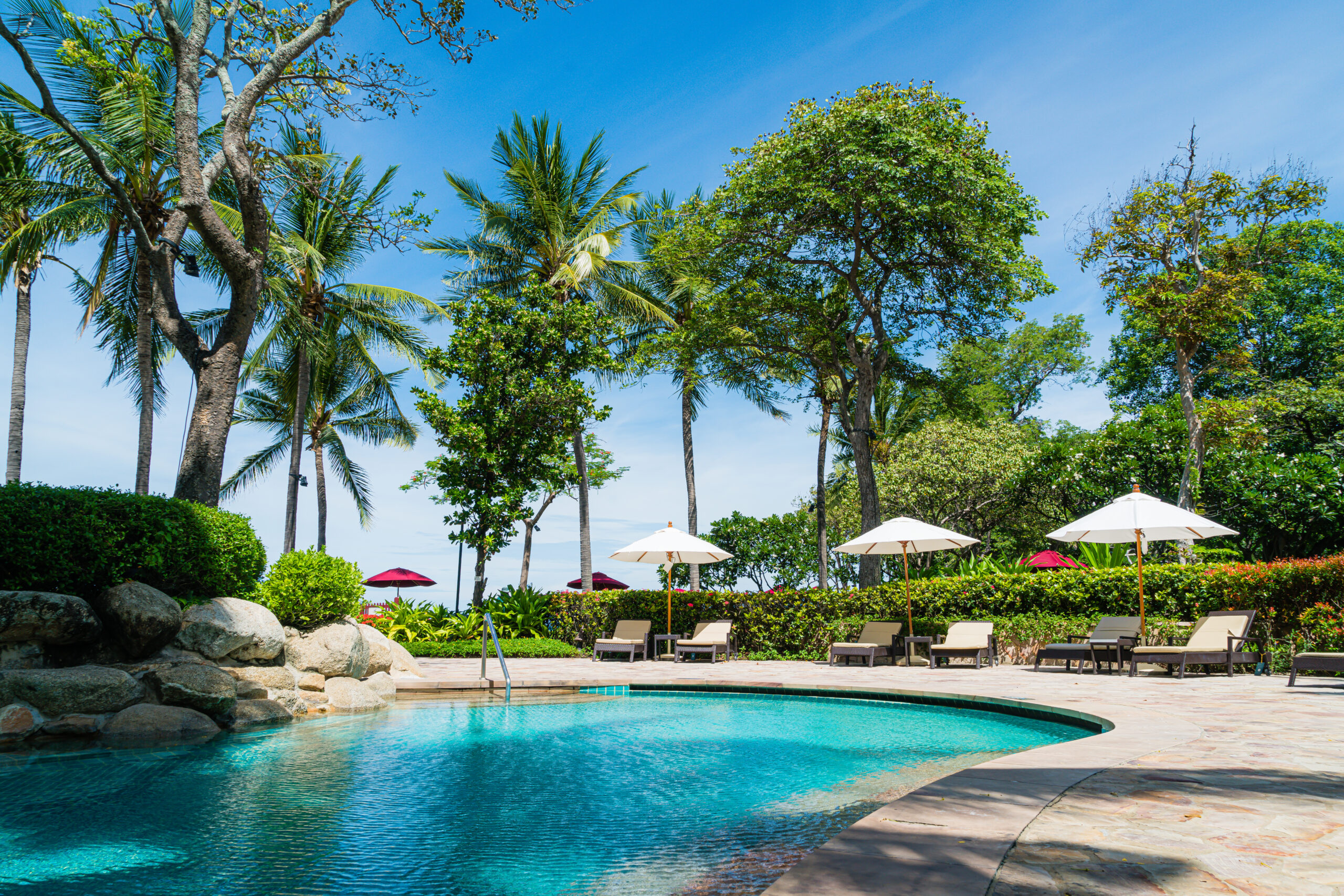 bed pool around swimming pool in hotel resort - holiday and vacation concept