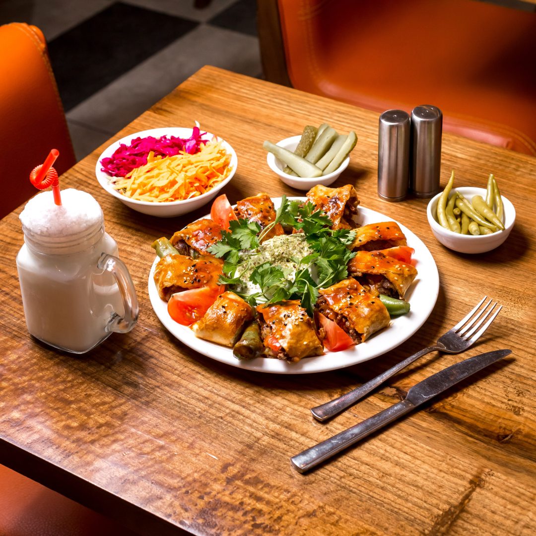 beyti kebab served with ayran and pickles